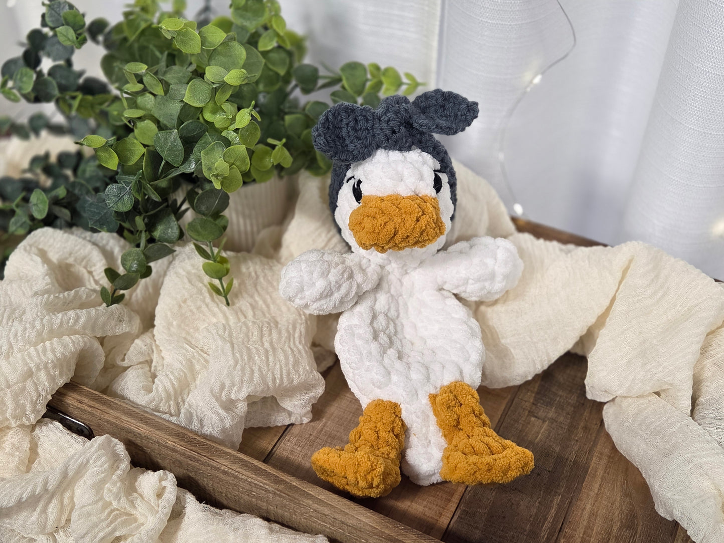 Baby Della Duck Snuggler - Dark Blue Headband